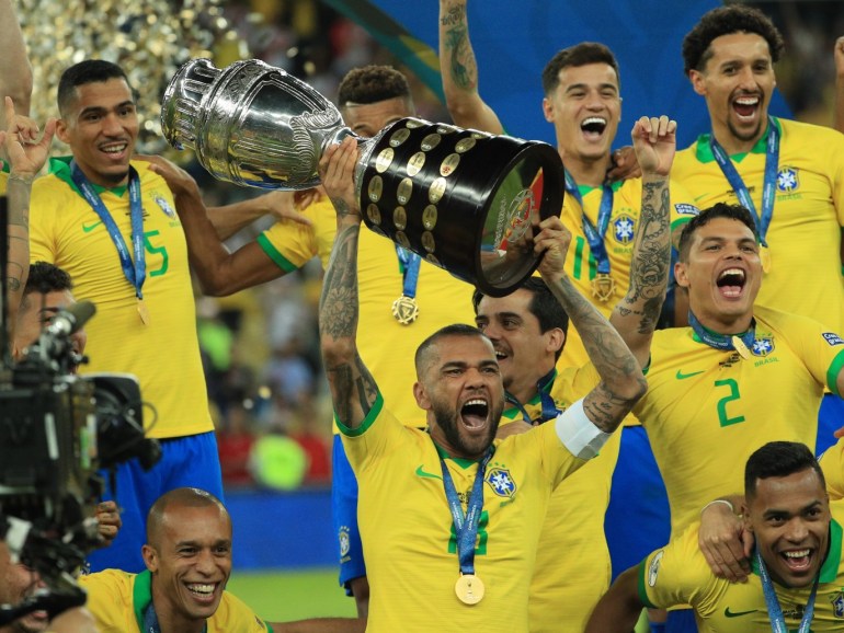 RIO DE JANEIRO, BRAZIL - JULY 07: Dani Alves of Brazil celebrates with the trophy and his teammates after winning the Copa America Brazil 2019 Final match between Brazil and Peru at Maracana Stadium on July 07, 2019 in Rio de Janeiro, Brazil. (Photo by Buda Mendes/Getty Images)