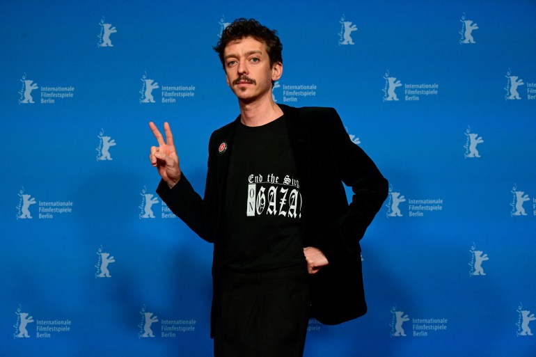 Argentine actor Nahuel Perez Biscayart poses wearing a "End the siege on Gaza" T-shirt during a photo call for the film 'Les gens dà côté' presented in the panorama section at the 74th Berlinale, Europe's first major film festival of the year, in Berlin on February 19, 2024. (Photo by John MACDOUGALL / AFP)