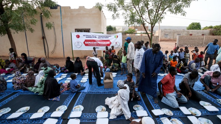 Food aid for Malian families by TDV on holy month of Ramadan- - BAMAKO, MALI - MAY 8: Malians are seen during an iftar (fast-breaking dinner) given by Directorate of Religious Affairs of Turkey and Turkiye Diyanet Foundation (TDV) within holy month of Ramadan in Bamako, Mali on May 8, 2019.