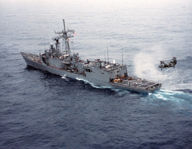 USS Samuel B. Roberts (FFG-58) underway after the ship struck a mine on 14 April 1988. A USMC CH-47 Sea Knight helicopter is on the helicopter pad. Naval History and Heritage Command photograph. (Catalog #: DN-SC-88-08601) Naval History and Heritage Command
