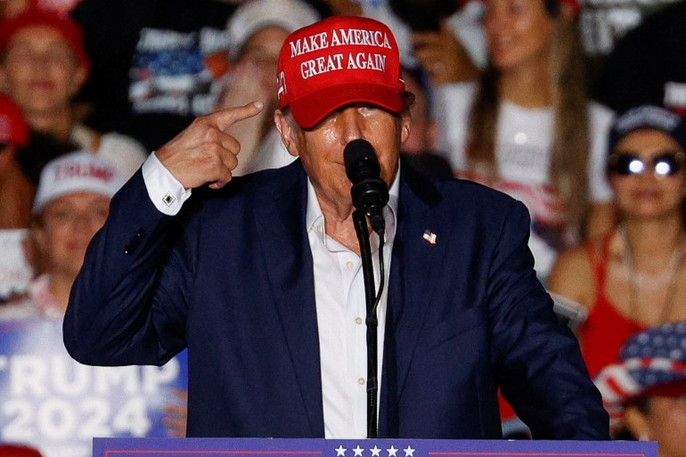 Republican presidential candidate and former U.S. President Donald Trump gestures during a campaign rally at his golf resort in Doral, Florida, U.S., July 9, 2024. REUTERS/Marco Bello