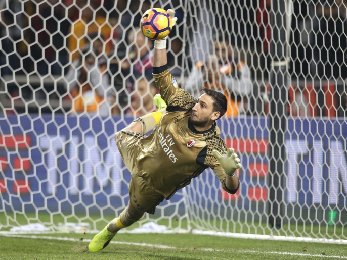 DOHA, QATAR - DECEMBER 23: Gianluigi Donnarumma ,Goalkeeper of AC Milan saving the ball from Juventus FC's Penalty during the Supercoppa TIM Doha 2016 match between Juventus FC and AC Milan at the Jassim Bin Hamad Stadium on December 23, 2016 in Doha, Qatar. (Photo by AK BijuRaj/Getty Images)