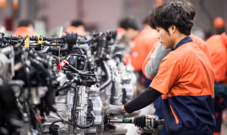 March 14, 2017, Linhai, Zhejiang Province, China, Geely Automobile Manufacturing Plant, assembly plant workers are assembling the engine, representing the highest level of China's state-owned car bran; Shutterstock ID 774597796; Department: -