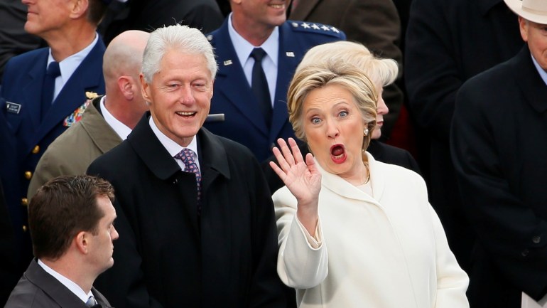 Former Secretary of State Hillary Clinton waves as she arrives with her husband former President Bill Clinton during inauguration ceremonies swearing in Donald Trump as the 45th president of the United States on the West front of the U.S. Capitol in Washington, U.S., January 20, 2017. REUTERS/Rick Wilking TPX IMAGES OF THE DAY