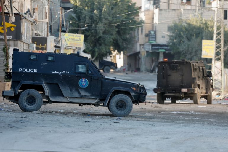 Palestinian security forces patrol amid clashes with militants at the camp in Jenin, in the Israeli-occupied West Bank, December 18, 2024. REUTERS/Raneen Sawafta