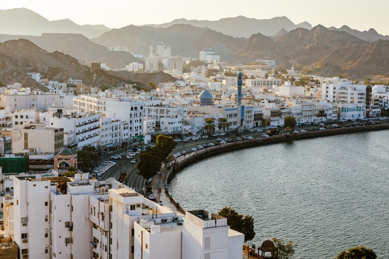 MUSCAT, OMAN - NOVEMBER 16, 2022: Mutrah Sunset. Cityscape View of Muscat at Beautiful Sunset. The Capital of Oman. Arabian Peninsula.