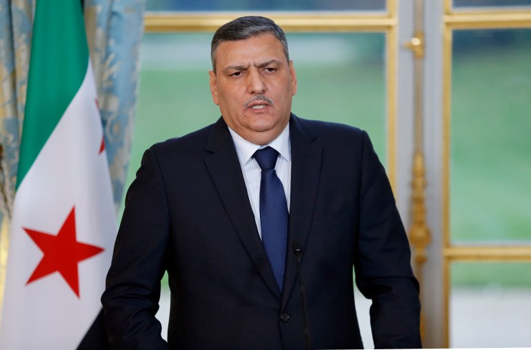 PARIS, FRANCE - DECEMBER 12: Riad Hijab, chief coordinator of the Syrian opposition's High Negotiations Committee (HNC), delivers a speech during a press conference with French President Francois Hollande following their meeting at the Elysee Presidential Palace on December 12, 2016. Francois Hollande called for the opening of a "humanitarian corridor" to channel the aid and let the civil populations leave the city of Aleppo. (Photo by Chesnot/Getty Images)