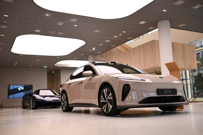 A NIO ET5 car model and the NIO EP9 sports car are pictured at the NIO House, the showroom of the Chinese premium smart electric vehicle manufacture NIO Inc. in Berlin, Germany August 17, 2023. REUTERS/Annegret Hilse