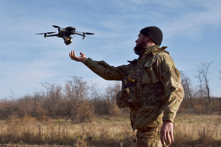 In this photo provided by the Ukraine's 65th Mechanised Brigade press service on Nov. 19, 2024, a Ukrainian soldier launches a drone during a training at a polygon in Zaporizhzhia region, Ukraine. (Andriy Andriyenko/Ukraine's 65th Mechanised Brigade via AP)