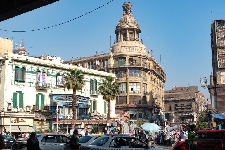 Cairo, Egypt. December 7th 2022 Busy Traffic crossing Attaba Square in front of the famous Tiring Building, an overcrowded district with a rich cultural heritage and history. Cairo, Egypt