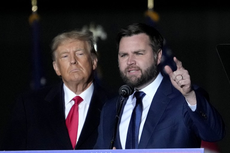 VANDALIA, OHIO - NOVEMBER 07: Former U.S. President Donald Trump and Republican candidate for U.S. Senate JD Vance greet supporters during the rally at the Dayton International Airport on November 7, 2022 in Vandalia, Ohio.†Trump campaigned at the rally for Ohio Republican candidates including Republican candidate for U.S. Senate JD Vance, who is running in a tight race against Democratic candidate for U.S. Senate Rep. Tim Ryan (D-OH). Drew Angerer/Getty Images/AFP (Photo by Drew Angerer / GETTY IMAGES NORTH AMERICA / Getty Images via AFP)