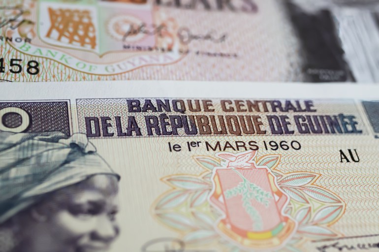 Closeup of old Guinea central bank GNF Franc currency banknote from 60s (focus on center) المصدر : أدوبي ستوك