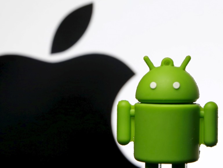 An Android mascot is seen in front of a displayed logo of Apple in this photo illustration taken in Zenica, Bosnia and Herzegovina, May 5, 2015. A U.S. appeals court on May 18, 2015 reversed part of a $930 million verdict that Apple Inc won in 2012 against Samsung Electronics Co Ltd, saying the iPhone maker's trademark-related appearance could not be protected. Some observers viewed the litigation as Apple's attempt to curtail the rapid rise of phones using Google Inc