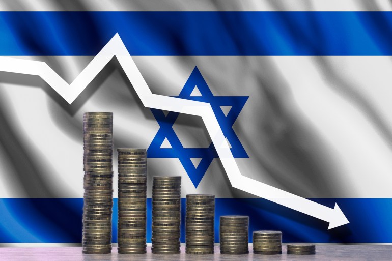 The graph of the fall. White arrow pointing down against the backdrop of coins and the flag of Israel; Shutterstock ID 1052210348; purchase_order: aj; job: ; client: ; other: