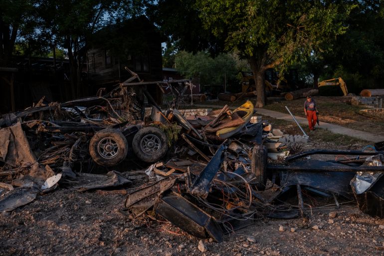 INGRAM, TEXAS - JULY 7: Twisted chassis of motor homes lie along the Guadalupe River after being swept away in flash flooding on July 7, 2025 in Ingram, Texas. Heavy rainfall early Friday caused severe flash flooding along the Guadalupe River in central Texas with more than 90 fatalities reported. Jim Vondruska/Getty Images/AFP (Photo by Jim Vondruska / GETTY IMAGES NORTH AMERICA / Getty Images via AFP)