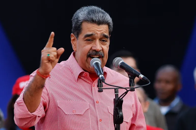 Venezuela's President Nicolas Maduro speaks during a demonstration for the swearing-in of Bolivarian committees in Caracas on November 15, 2025. (Photo by STRINGER / AFP)