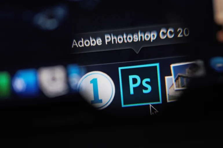 New-York , USA - March 13, 2020: Starting adobe photoshop program on laptop close up view