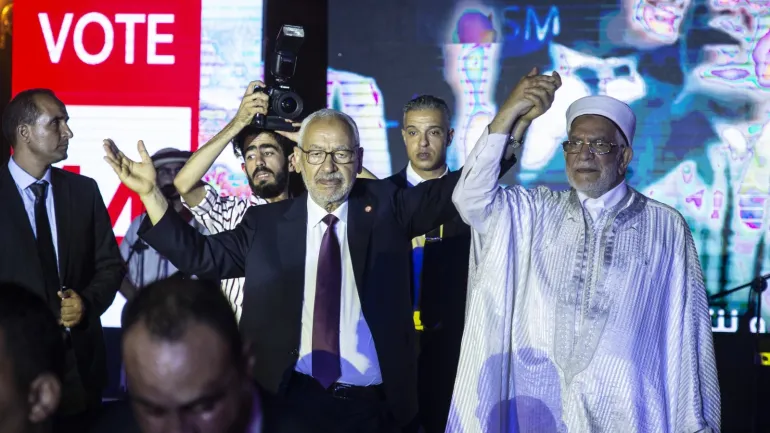 Ahead of presidential elections in Tunis- - TUNIS, TUNISIA - SEPTEMBER 13: Nahda Movement Candidate for the presidential election in Tunisia Abdul Fattah Moro (R) and Nahda Movement leader Rached Ghannouchi (C) attend a rally Moro he holds a meeting at Habib Burgiba Street as part of the election campaign ahead of Tunisia's presidential election, on September 13, 2019 in Tunis, Tunisia.