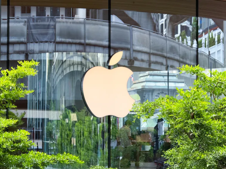Bangkok, Thailand - June 21, 2025: Exterior Apple logo at Central World Apple Store reflecting lush greenery and architecture. High quality photo