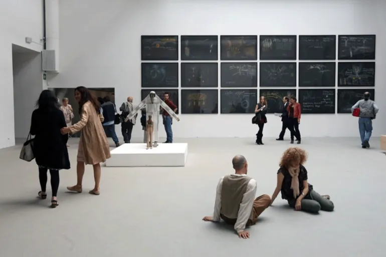 VENICE, ITALY - JUNE 01: General view of the work of Tino Sehgal at Central Pavilion during the official opening of The 55th International Art Exbhibition at Giardini on June 1, 2013 in Venice, Italy. The 55th International Art Exhibition of La Biennale di Venezia will be open to the public from June 1 - November 24, 2013. (Photo by Barbara Zanon/Getty Images)