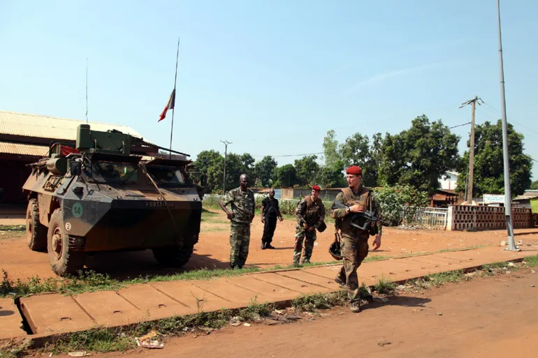 BANGUI, CENTRAL AFRICAN REPUBLIC - FEBRUARY 14: French army soldiers hold their weapons as they patrol in the capital Bangui, Central African Republic (CAR) on February 13, 2014. (Photo by Talel Nacer/Anadolu Agency/Getty Images)
