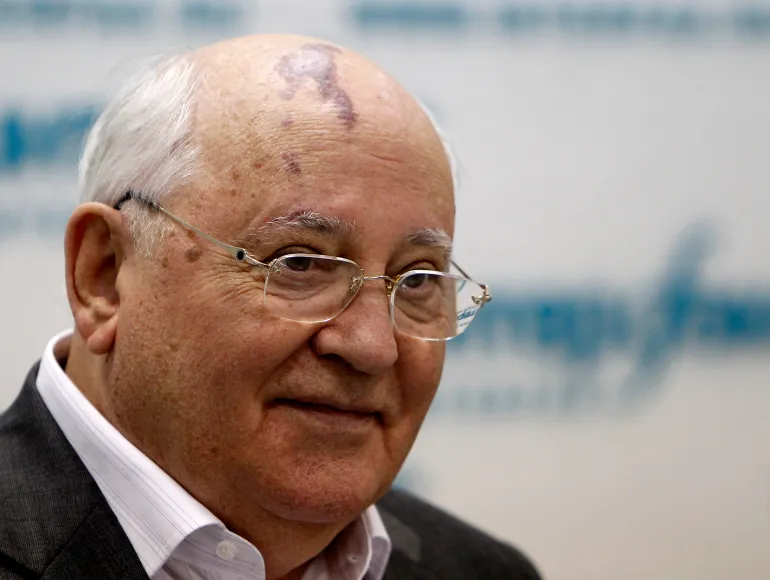 Former Soviet President Gorbachev listens during a news conference in Moscow