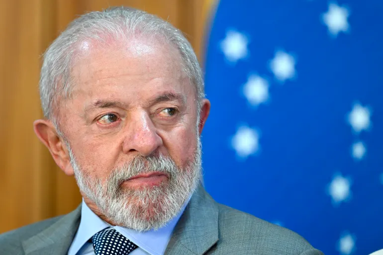 Brazil's President Luiz Inacio Lula da Silva gestures during the launch of a program to support taxi drivers at Planalto Palace in Brasilia on July 14, 2025.