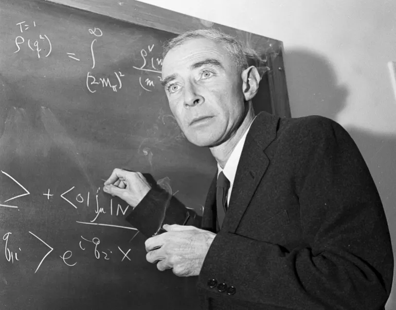 FILE - Dr. J. Robert Oppenheimer, creator of the atom bomb, is shown in his study at the Institute for Advanced Study, Dec. 15, 1957, in Princeton, N.J. RR Auction in Boston is taking bids on a rare 1945 report, as well as a letter to a journalist signed by “Opie” that describes the bomb as a “weapon for aggressors.” By Saturday, March 9, 2024, bids for the report had topped $35,000 while the letter was closing in on $5,000. The auction ends Wednesday, March 13. (AP Photo/John Rooney, File)