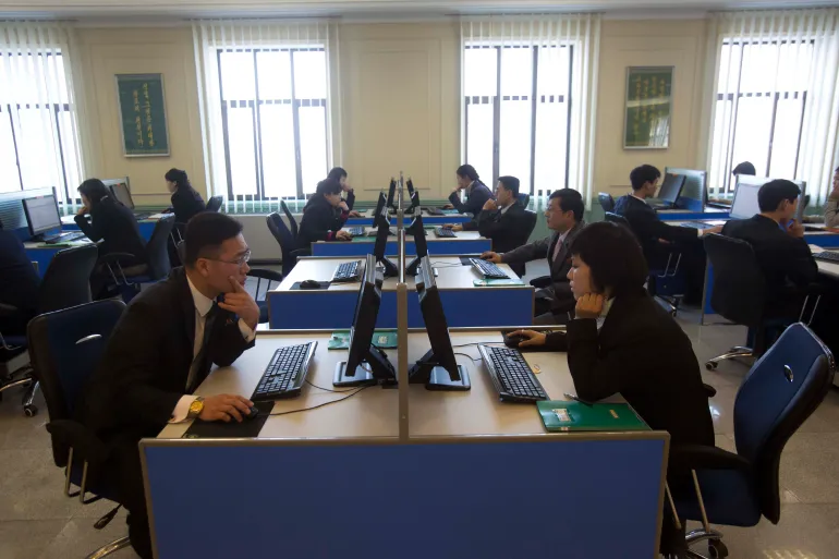 FILE - In this Jan. 8, 2013 file photo, North Korean students surf the internet at computer terminals inside a computer lab at Kim Il Sung University in Pyongyang, North Korea during a tour by Executive Chairman of Google, Eric Schmidt. North Korea on Friday, March 15, 2013, blamed South Korea and the United States for cyberattacks that temporarily shut down websites this week at a time of elevated tensions over the North's nuclear ambitions. Experts, however, indicated it could take months to determine what happened and one analyst suggested more likely culprits: hackers in China. (AP Photo/David Guttenfelder, File)