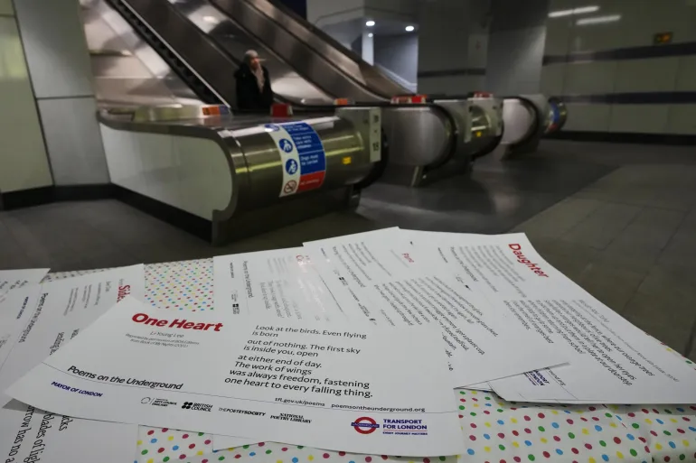 Poems are laid out on a table at a gathering to celebrate 40 years of 'Poems on the Underground' in London, Friday, Jan. 30, 2026. (AP Photo/Kirsty Wigglesworth)