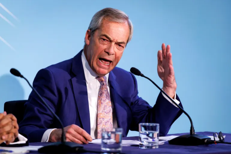epa12533075 Reform UK leader Nigel Farage speaks during a press conference in London, Britain, 18 November 2025. Farage, on behalf of Reform UK, has proposed ending Universal Credit (UC) payments for all foreign nationals in the UK, including EU citizens who have settled status, which would break commitments made in the post-Brexit trade deal between the UK and the European Union regarding citizens' rights and access to social security. EPA/TOLGA AKMEN