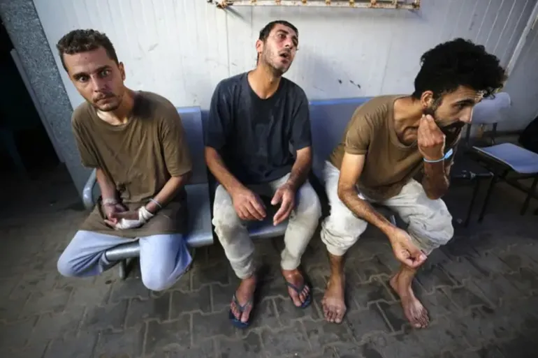 Badr Dahlan (L) and other detainees were seen to be weakened and had scars on their bodies following their release on June 20. (Getty Images)