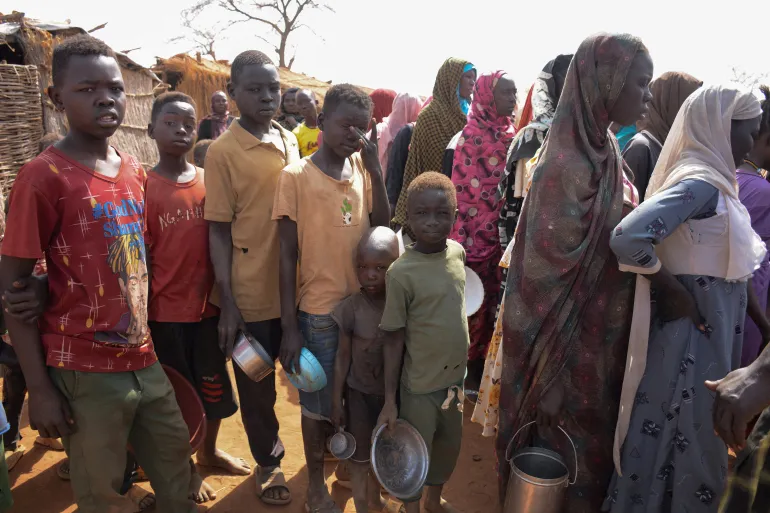 Newly arrived displaced people queue to receive meals at Thobo Camp, in Engpung County, Sudan, January 29, 2026. Karl Schembri/Norweigan Refugee Council/Handout via REUTERS THIS IMAGE HAS BEEN SUPPLIED BY A THIRD PARTY.