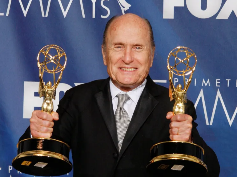 FILE PHOTO: Actor Robert Duvall holds the two Emmy awards he won as Outstanding Lead Actor in a mini-series or movie for "Broken Trail' and as executive producer for 'Broken Trail' which won for Outstanding mini-series at the 59th Primetime Emmy Awards in Los Angeles, California September 16, 2007. REUTERS/Lucy Nicholson/File Photo