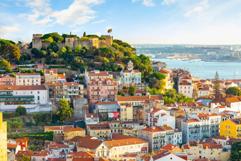 Lisbon, Portugal skyline at Sao Jorge Castle at sunset.