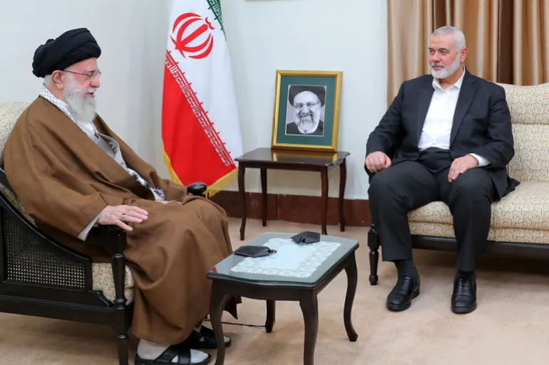 A handout picture provided by the office of Iran's Supreme Leader Ayatollah Ali Khamenei on May 22, 2024, shows him (R) and vice president Mohammad Mokhber, accting as caretaker president (L), meeting with the leader of Palestinian militant group Hamas, Ismail Haniyeh, in Tehran. Khamenei led prayers for late president Ebrahim Raisi on May 22, as huge crowds thronged the capital Tehran for his funeral procession. Raisi and his entourage died in a helicopter crash on May 20. - === RESTRICTED TO EDITORIAL USE - MANDATORY CREDIT "AFP PHOTO / HO / IRANIAN PRESIDENCY" - NO MARKETING NO ADVERTISING CAMPAIGNS - DISTRIBUTED AS A SERVICE TO CLIENTS === (Photo by IRANIAN SUPREME LEADER'S WEBSITE / AFP) / === RESTRICTED TO EDITORIAL USE - MANDATORY CREDIT "AFP PHOTO / HO / IRANIAN PRESIDENCY" - NO MARKETING NO ADVERTISING CAMPAIGNS - DISTRIBUTED AS A SERVICE TO CLIENTS ===