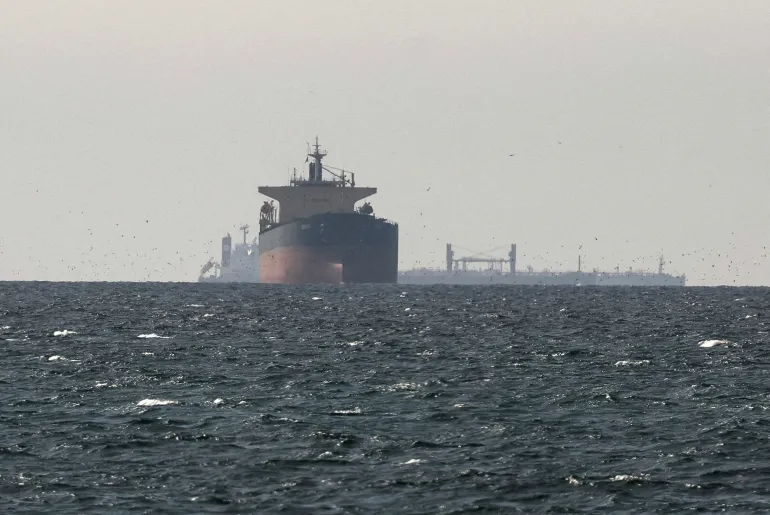 FILE PHOTO: Tankers sail in the Gulf, near the Strait of Hormuz, as seen from northern Ras al-Khaimah, near the border with Oman’s Musandam governance, amid the U.S.-Israeli conflict with Iran, in United Arab Emirates, March 11, 2026. REUTERS/Stringer/File Photo
