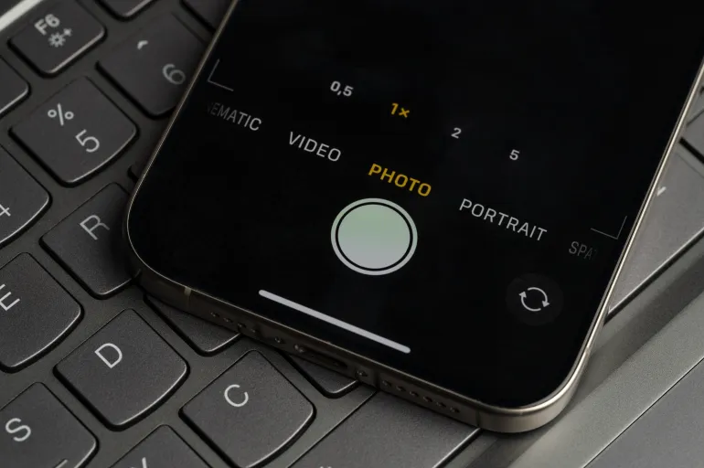 New York, USA - November 26, 2024: Iphone camera mode menu on screen in keyboard button background close up view
