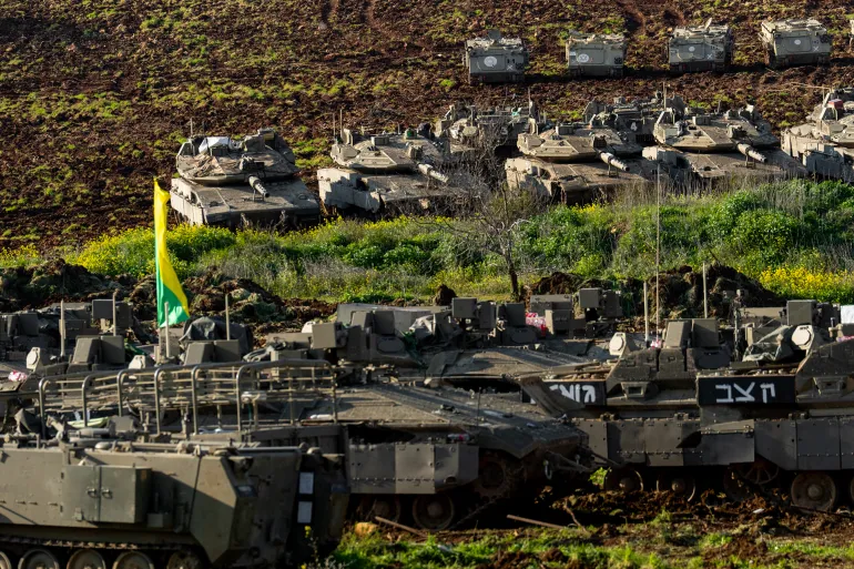 NORTHERN ISRAEL - MARCH 7: Israeli tanks are parked near a wall near the border with Lebanon on March 7, 2026 in northern Israel. Israel has continued its aerial and ground assault in Lebanon after Hezbollah, the Iran-backed militant group in Lebanon, launched missiles at Israel in what it said was retaliation for the joint U.S.-Israeli war on Iran. (Photo by Erik Marmor/Getty Images)