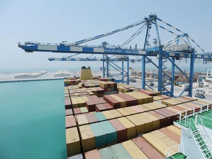 Containers are stacked under cranes at a container terminal in Khalifa Port during its opening in Taweelah, Abu Dhabi September 1, 2012. Abu Dhabi launched operations at a multi-billion dollar port facility on Saturday, seeking to diversify its oil-based economy with a project that could intensify competition for the region's shipping traffic with neighbouring emirate Dubai. Abu Dhabi Ports Co (ADPC) said Khalifa Port, built on a man-made island in the Taweelah area, and its adjacent Khalifa Industrial Zone would together be two-thirds the size of Singapore when fully built. REUTERS/Ben Job (UNITED ARAB EMIRATES - Tags: MARITIME BUSINESS)