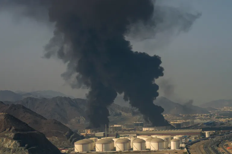 Fire and plumes of smoke rise from an oil facility in Fujairah, United Arab Emirates, Saturday, March 14, 2026. (AP Photo/Altaf Qadri)
