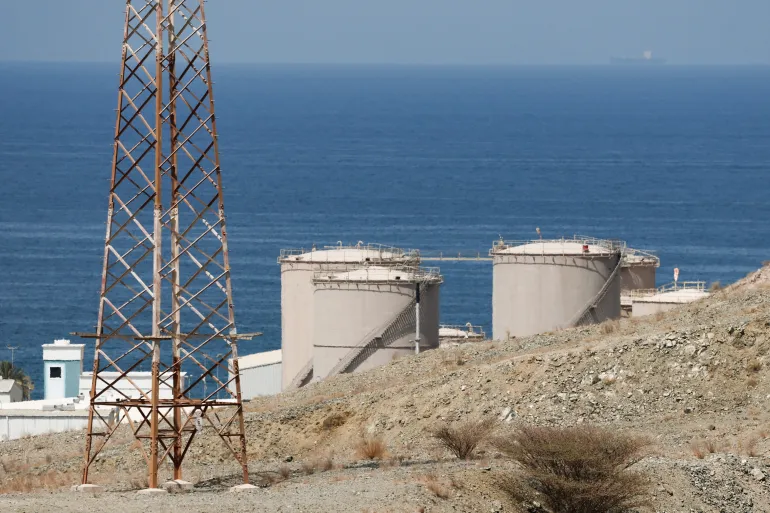 Storage tanks of the Petroleum Development Oman (PDO) oil refinery, amid the U.S.-Israeli conflict with Iran, in Muscat, Oman, March 12, 2026. REUTERS/Benoit Tessier