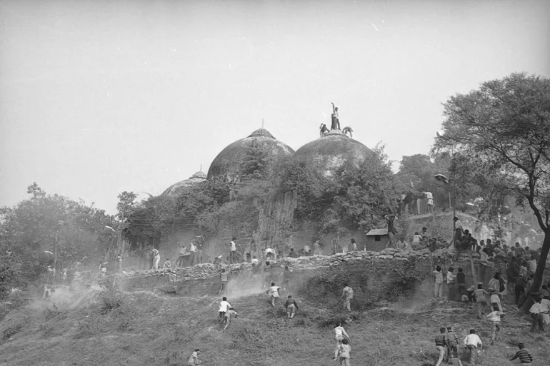 AYODHYA, INDIA - DECEMBER 6, 1992: Karsevaks atop the Babri masjid shortly before it was demolished on December 6, 1992 at Ayodhya (Photo by Sanjay Sharma/Hindustan Times via Getty Images)