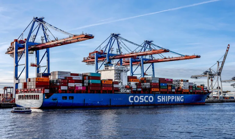 (FILES) Container ship 'Xin Lian Yun Gang' of China COSCO Shipping Corporation is moored at the Tollerort Container Terminal owned by HHLA, in the harbour of Hamburg, northern Germany on October 26, 2022.