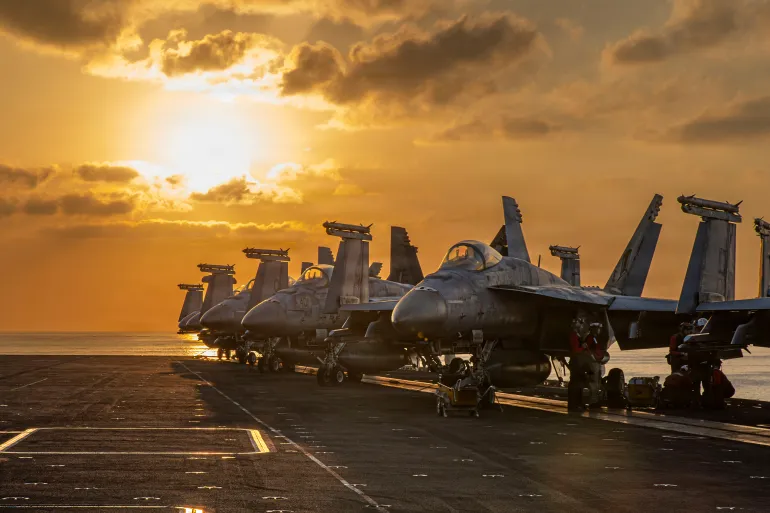 This image provided by U.S. Central Command shows aircraft on the flight deck of the USS Abraham Lincoln (CVN 72) that are operating in support of the war in Iran, on Tuesday, March 3, 2026. (U.S. Navy via AP)
