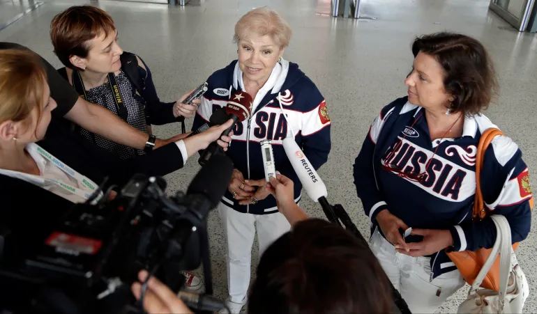 Larisa Latynina, the gymnast who won 18 medals in the 1956, 1960 and 1964 Olympics while competing for the Soviet Union, speaks to reporters at the 2012 Summer Olympics, Wednesday, Aug. 1, 2012, in London. Latynina's career record for most Olympic medals was broken by Michael Phelps on Tuesday. (AP Photo/Gregory Bull)