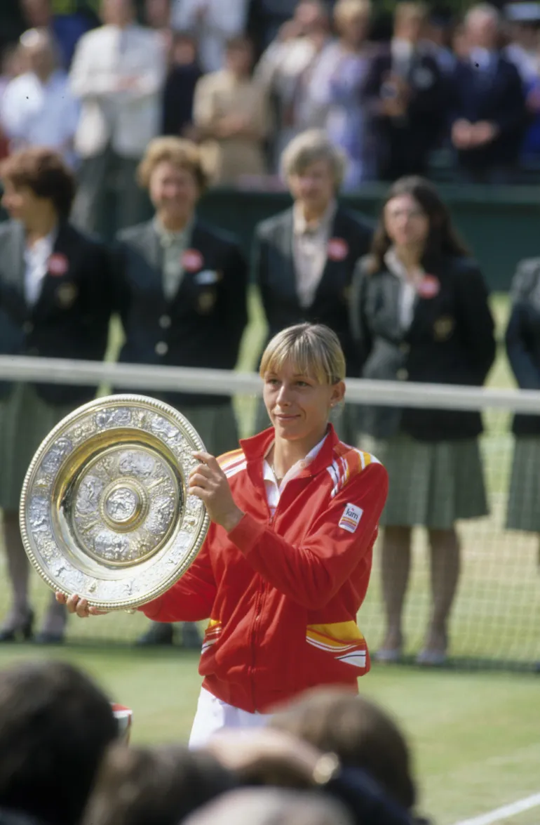 LONDON - JUNE 1982: Martina Navratilova lifts the winning trophy after beating Chris Evert in the Wimbledon Lawn Tennis Championships Final held in 1982 at the All England Lawn Tennis and Croquet Club in London. (Photo by Tony Duffy/Getty Images)