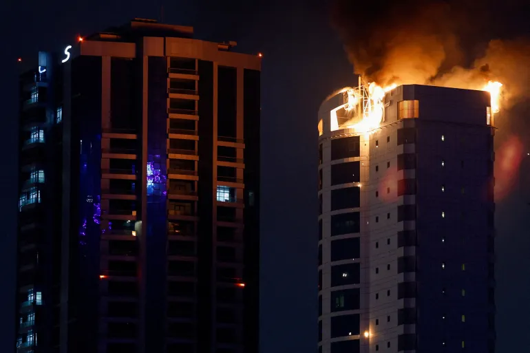 Smoke rises from a burning building hit by an Iranian drone strike, after Israel and the U.S. launched strikes on Iran, in Seef district, Manama, Bahrain, February 28, 2026. REUTERS/Hamad I Mohammed TPX IMAGES OF THE DAY