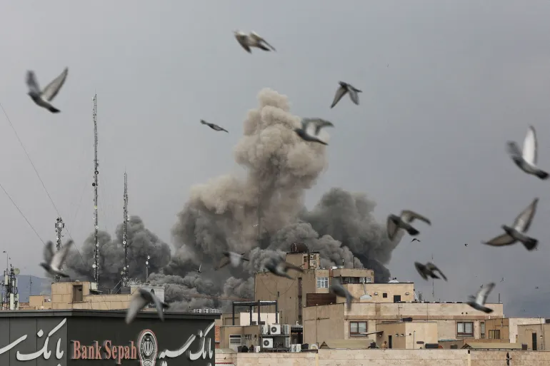 Birds fly as smoke rises following an explosion, after Israel and the U.S. launched strikes on Iran, amid the U.S.-Israel conflict with Iran, in Tehran, Iran, March 2, 2026. Majid Asgaripour/WANA (West Asia News Agency) via REUTERS ATTENTION EDITORS - THIS PICTURE WAS PROVIDED BY A THIRD PARTY