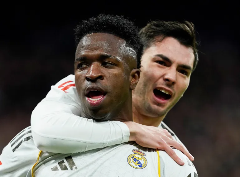 Soccer Football - LaLiga - Real Madrid v Rayo Vallecano - Santiago Bernabeu, Madrid, Spain - February 1, 2026 Real Madrid's Vinicius Junior celebrates scoring their first goal with Brahim Diaz REUTERS/Ana Beltran